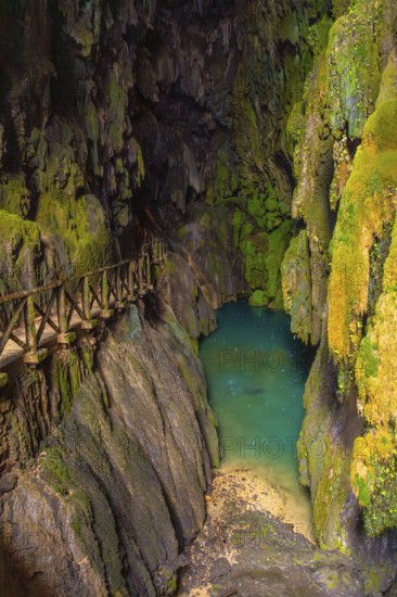 Beautiful colours inside the Iris Grotto at the Cola de Caballo Waterfall in the Monasterio de