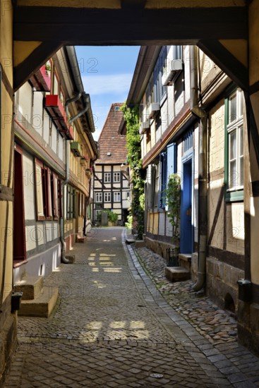 Idyllic narrow alley with half-timbered houses and cobblestones in the historic old town, passage