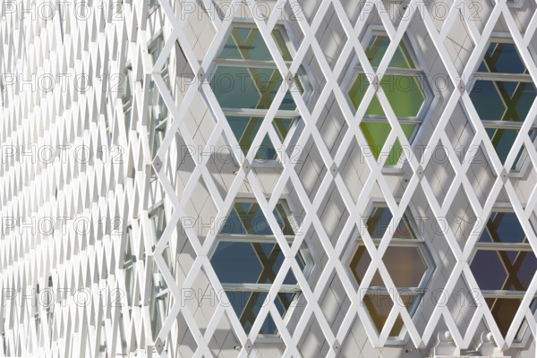 Abstract view of a auditorium facade showcasing geometric patterns of interlocking diamond shapes