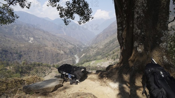 Far reaching view from a vantage point over a river valley and mountain landscape, two large