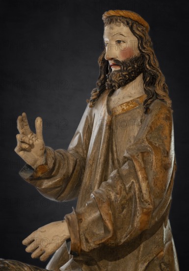 Palm tree donkey, wooden figure from 1470, on a dark background, Franciscan Museum, Villingen,
