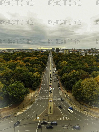 Street in the city surrounded by autumn trees, houses on Hoirzont under cloudy sky, view from