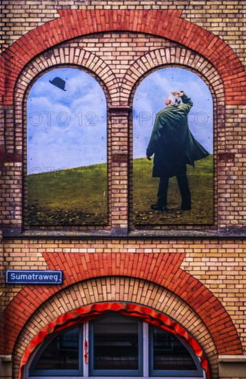 Artistic wall design on the Sumatraweg, scene strongly reminiscent of the surrealist works of René