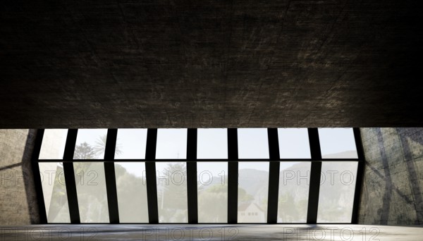 Large geometric windows frame a scenic view, with natural light illuminating the textured concrete