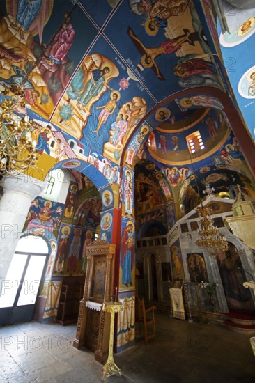 Colourful frescoes of Christ on the ceiling and walls of a 200-year-old church in Lagia, Mani,