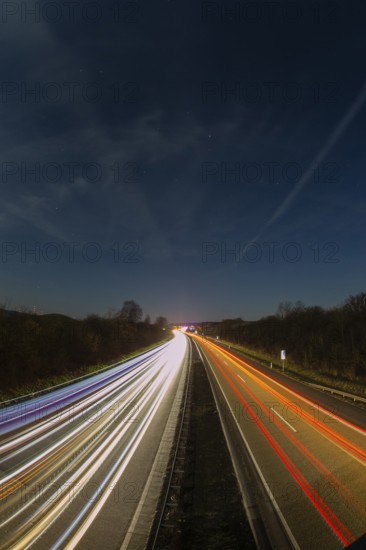 A7 Motorway, Autobahn, beside Kassel at night with light trails from the traffic headlights and