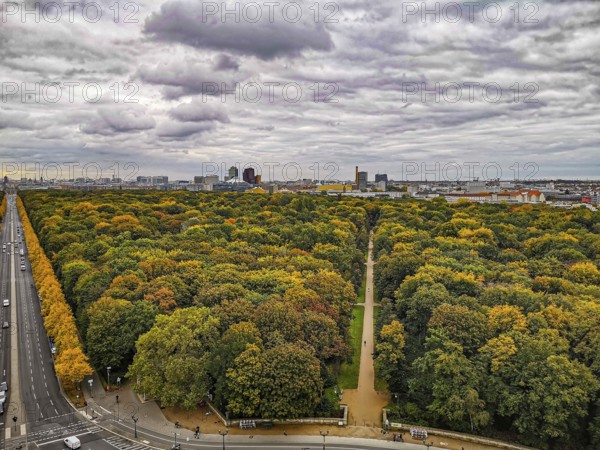 The city of Berlin in autumn with extensive forest and dramatic sky in the background, view from