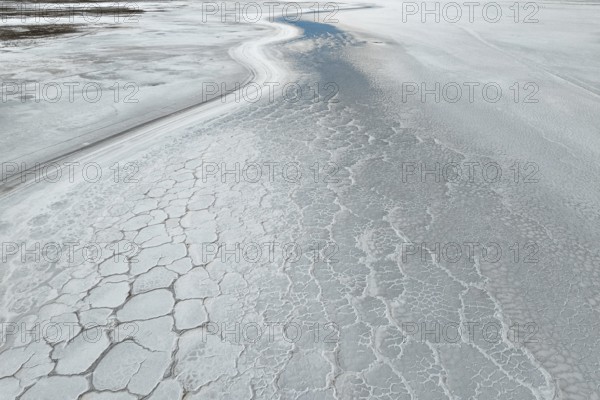 A mesmerizing aerial view of a saline mud landscape, showcasing intricate natural patterns and