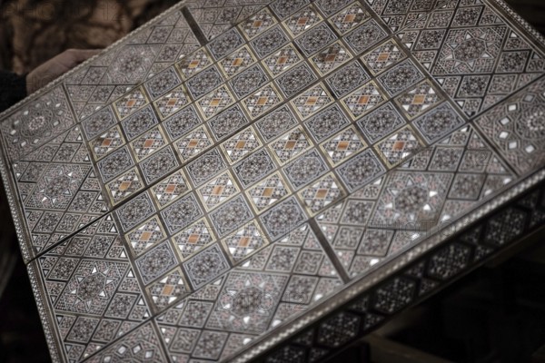 Damascus, Syria. December 10th 2025. Close-up detail of a handmade mosaic wooden backgammon box