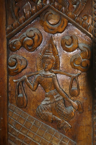 Temple door decorated with wood carvings in Buddhist monastery complex Buddhist temple complex Wat