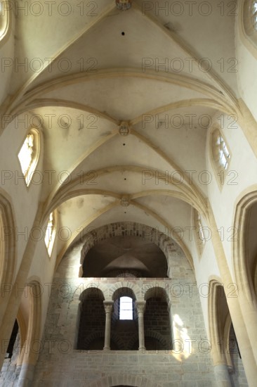 Interior of Saint-Sebastien Church in Manglieu, featuring Romanesque arches, Puy de dome