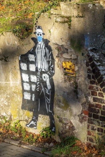 Mural on the theme of toilet paper hoarding, during the Corona crisis, on an old harbour building,