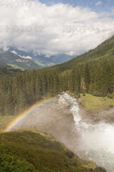 Krimml Waterfalls with rainbow. They have a total height of 380 metres (1, 247 feet) and are the