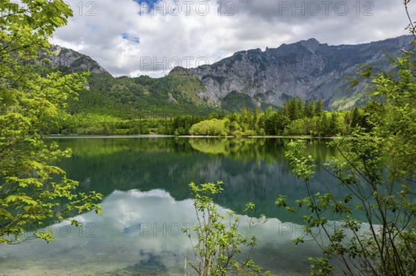 Landscape of Lake Offensee after rain when the sun comes through the clouds in spring,