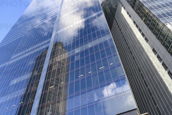 Modern abstract reflections in glass fronted commercial office buildings in the financial district