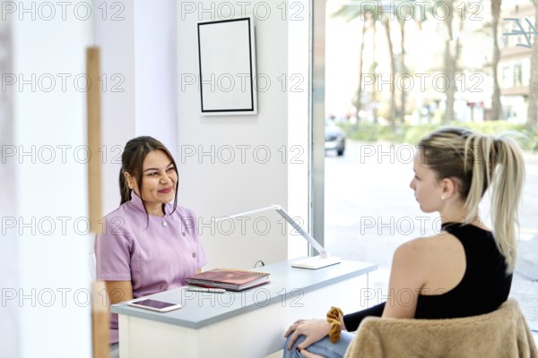 A beauty consultant interacts with a client at a professional salon, providing personalized service