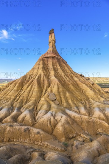 Majestic castildetierra rock formation rises against a vibrant blue sky in the bardenas reales