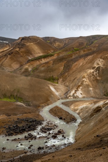 Steaming streams between colourful rhyolite mountains, Hveradalir geothermal area, Kerlingarfjöll,
