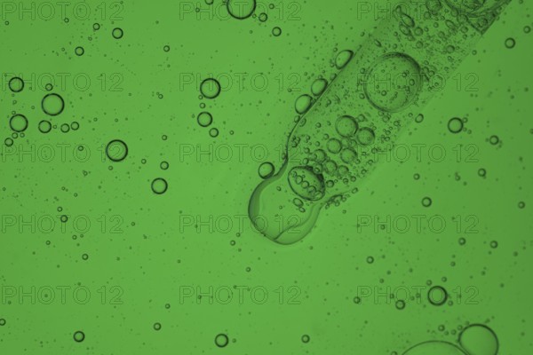 A detailed image showcasing a vibrant aloe vera liquid for a serum cosmetic, creating a mesmerizing