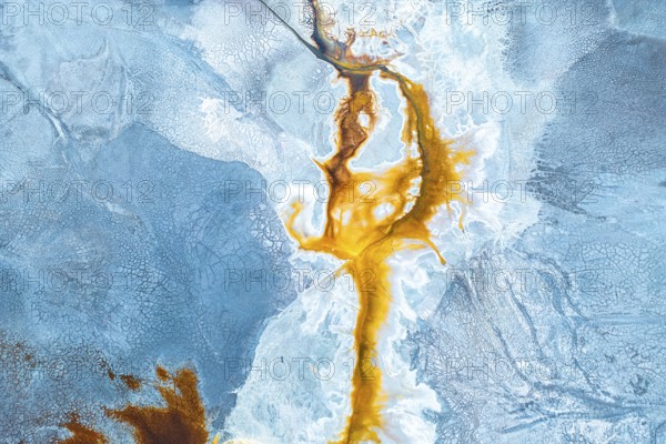 Aerial photo capturing a vibrant, abstract landscape where natural textures and colors mix