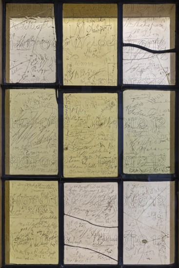 Interior photograph, visitors' signatures carved into window glass, William Shakespeare's