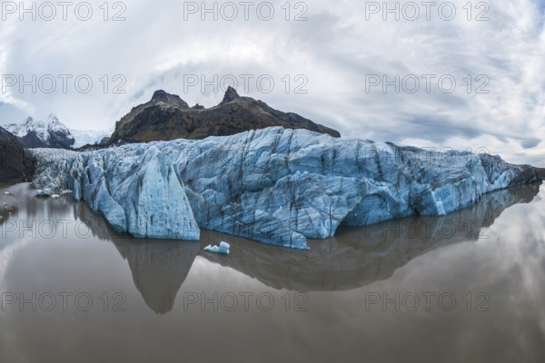 Captivating view of the expansive Vatnajökull Glacier, reflecting in calm waters at Vatnajökull