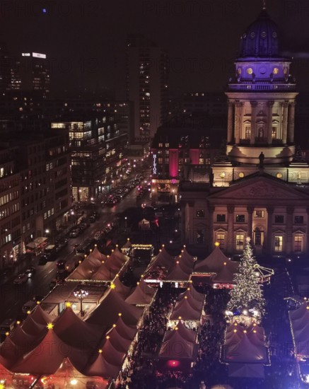 Aerial view of an illuminated Christmas market at Gendarmenmarkt at night with distinctive