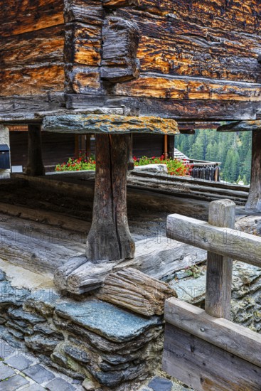 Old barn on wooden supports and stone slabs, historic village centre, Grimentz, Val d'Anniviers,