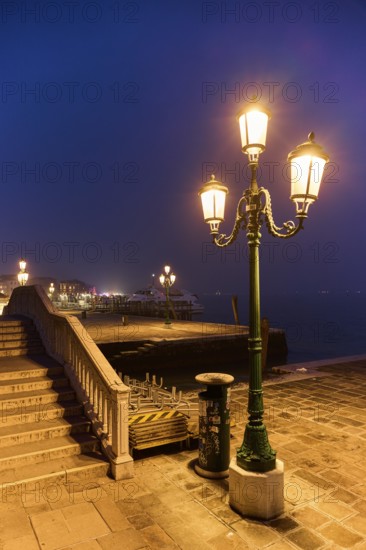 Lanterns at 'Alilaguna' on a evening in the blue hour in Venice in winter, Italy