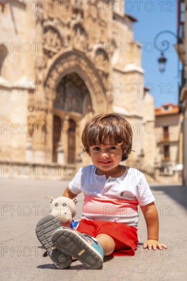 Child having fun in the church of Santa María la Real in Aranda de Duero in the province of Burgos.