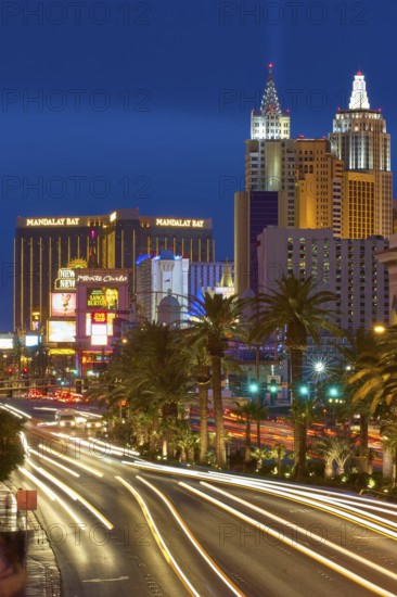 Nighttime urban scene in Las Vegas with brightly lit buildings, New York-New York Hotel and Casino,