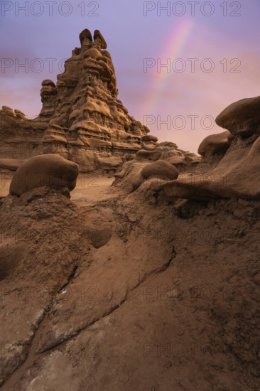 Captivating view of unique sandstone formations under a colorful sky in Goblin Valley State Park,
