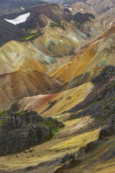 Small river between colourful rhyolite mountains, volcanic landscape, erosion landscape, view from