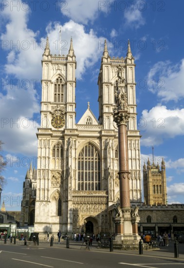Towers and frontage of Westminster abbey church with Victoria Tower in background, Westminster,