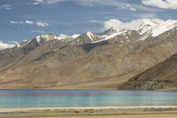 Beautiful view of Pangong Tso lake in Ladakh, India, with its brilliant blue waters set against the