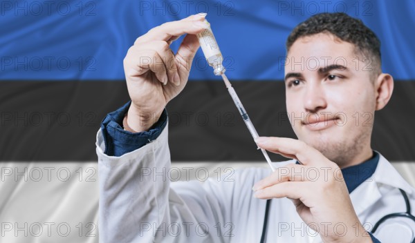 Doctor holding syringe on Estonia flag background. Medical professional holding syringe with