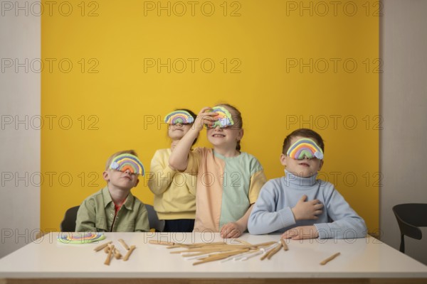 Children engage in a vibrant lesson, creatively using rainbow props to stimulate imagination and