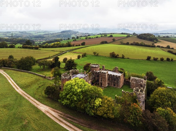 Autumn Colours over ruins of Pembridge Castle or Newland Castle from a drone, Herefordshire,