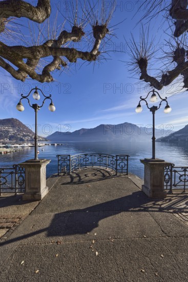 Lake, lakeside promenade, lanterns, trees, railings, mountains, haze, shadow, backlight, Lake