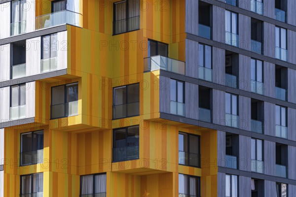 A striking example of modern architecture utilizing a mix of glass, concrete, and metal, featuring