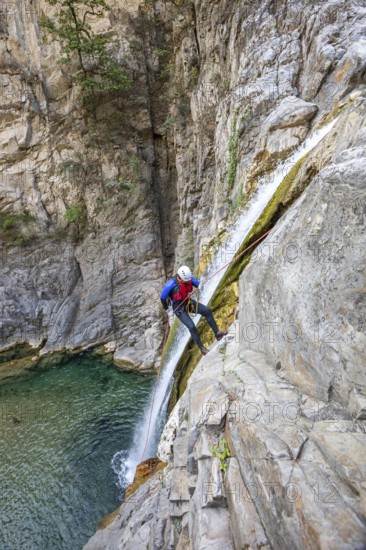 Enthusiastic canyoneer participates in exciting canyoning and rappelling activities in Matacanes,