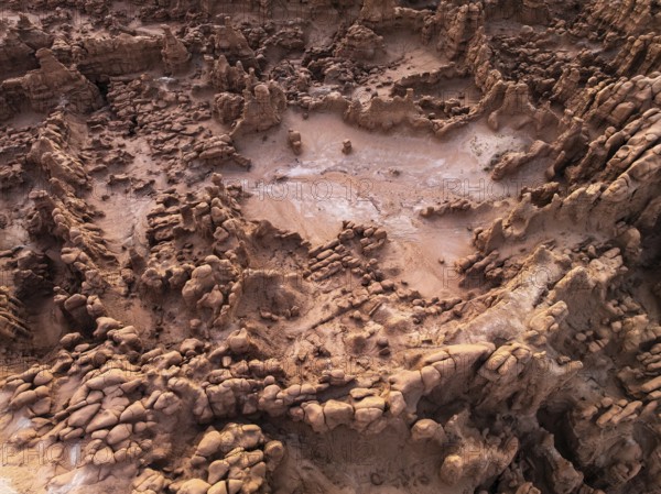 A captivating aerial shot of the textured, rocky formations at Goblin Valley State Park, Utah,