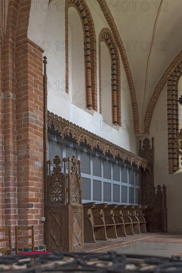Gothic choir stalls in the interior of St Mary's Church, Brick Gothic, Klütz, Mecklenburg-Western