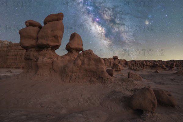 Captivating view of the Milky Way galaxy shining brightly over the unique hoodoo rock formations of
