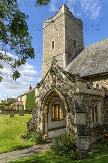 Tower and porch of village parish church of All Saints, Rede, Suffolk, England, UK