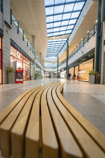 Interior view of a modern shopping centre with long bench and glass roof, Sterncenter Sindelfingen,