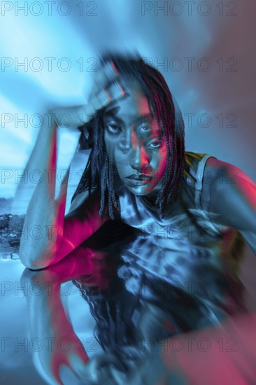 A futuristic portrait of a young African woman in a vibrant, digital metaverse. The image blends