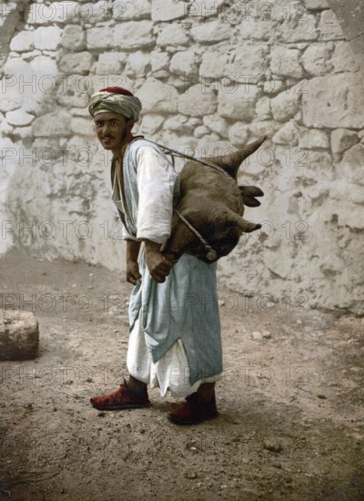 Water carrier, water seller with a goat bellows in Jerusalem, today Israel, Historical, digitally