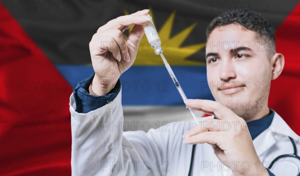 Doctor holding syringe on Antigua and Barbuda flag background. Medical professional holding syringe