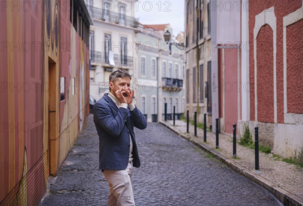 Man musician in a blue blazer and white sweater playing blues on a harmonica with eyes closed,